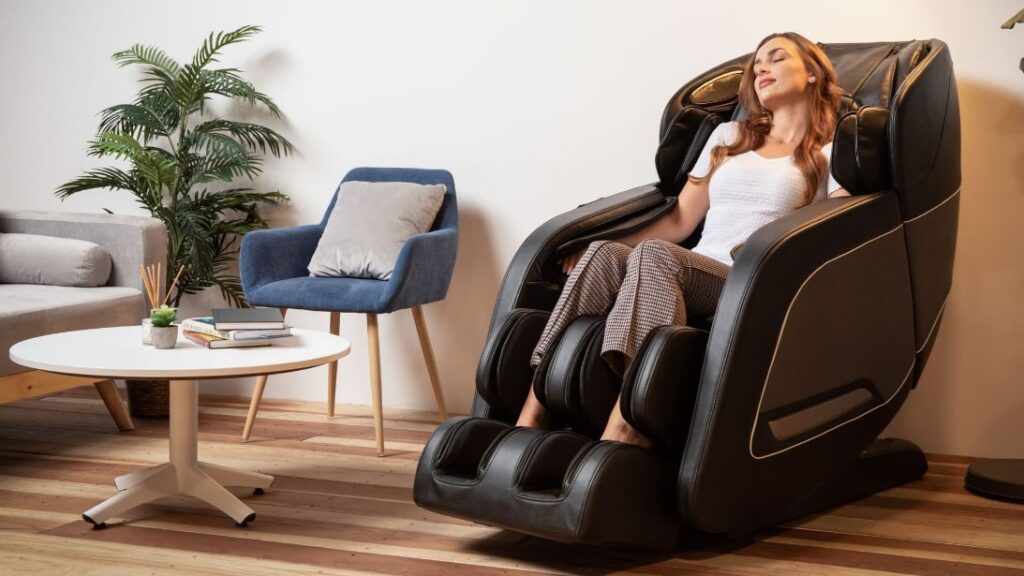 A woman sitting on a massage chair with her eyes closed